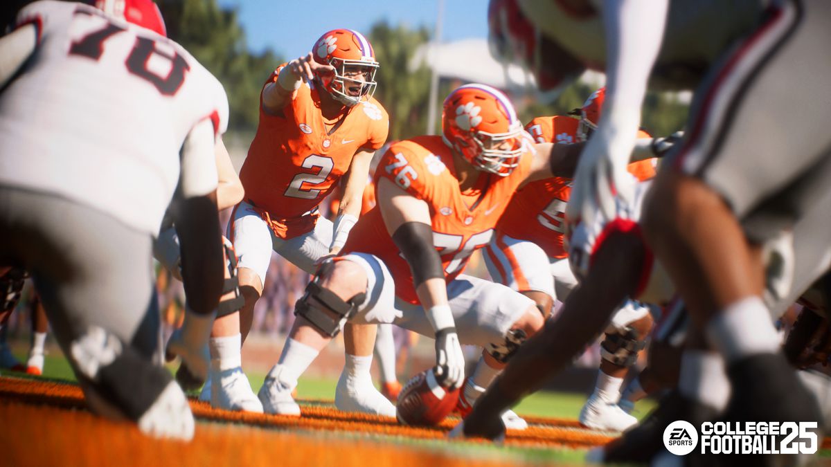 the Clemson Tigers quarterback, under center, points to call out something he has recognized in the defense in a screenshot from EA Sports College Football 25