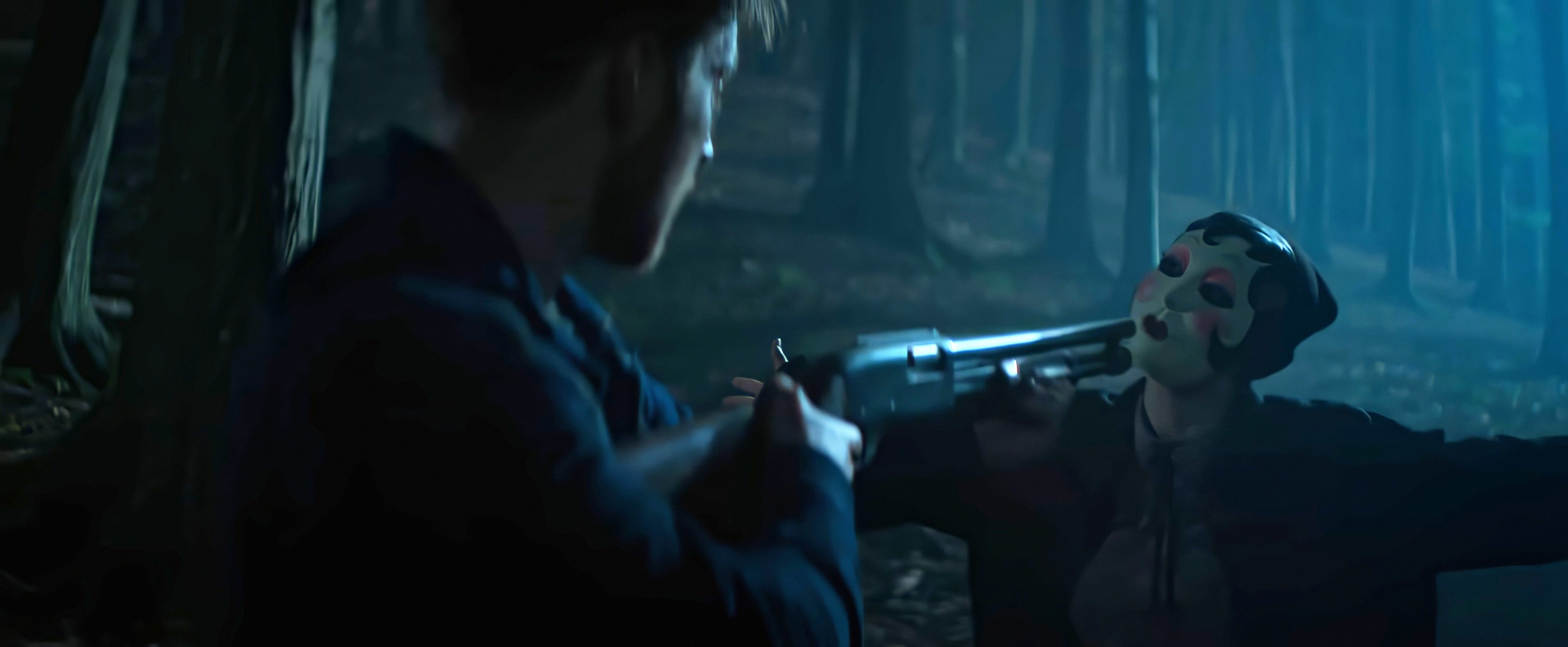 A man with his back to the camera holds a shotgun to the face of a person in a stylized female mask in the woods at night in The Strangers: Chapter 1