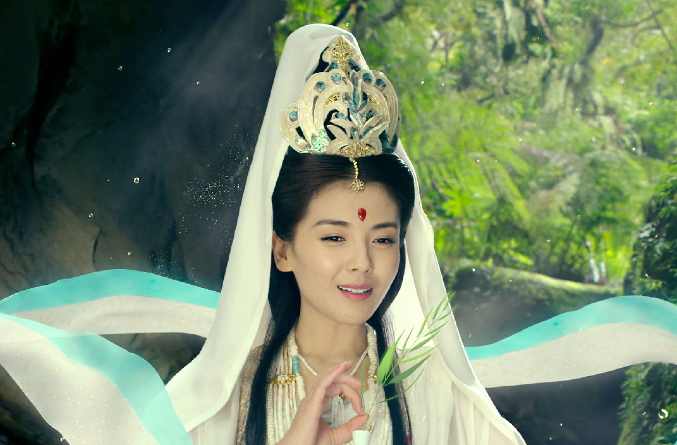 A woman with a headdress sits in the forest in The Monkey King 3 