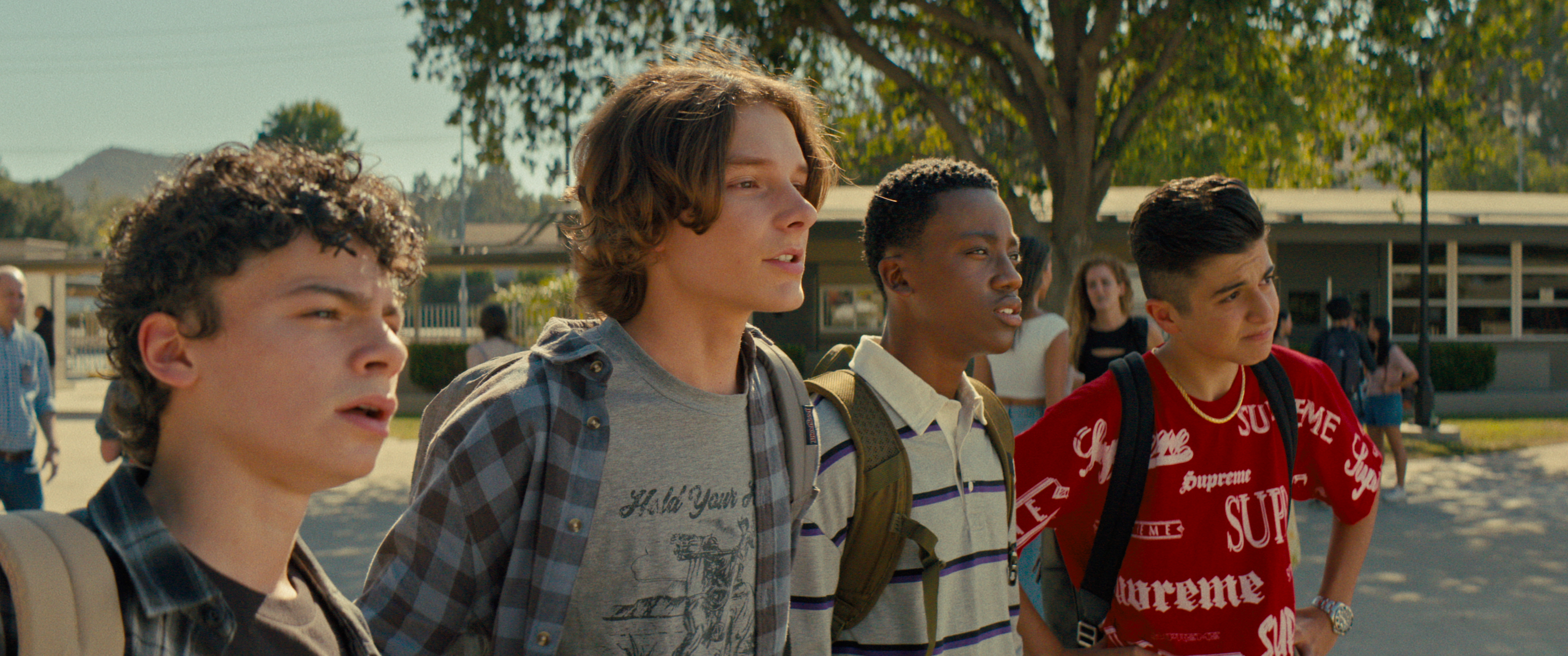 A group of teenagers standing outside in Incoming.