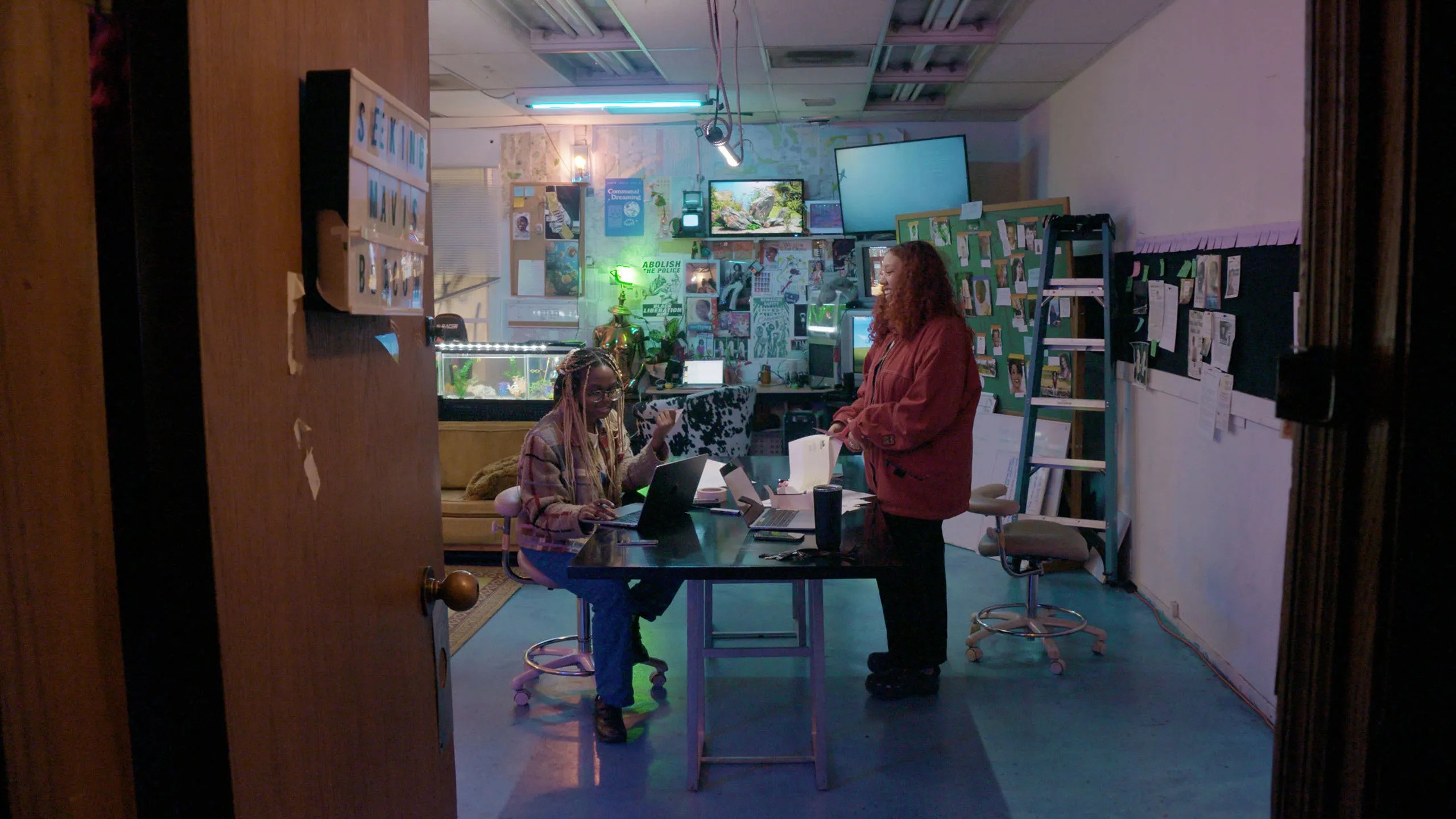 Two women in a school science lab room in Seeking Mavis Beacon.