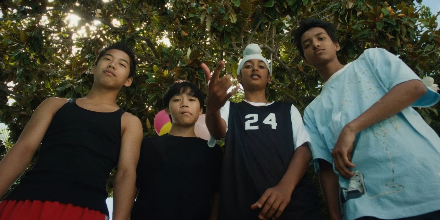 A group of boys posing in front of a camera in Dìdi.