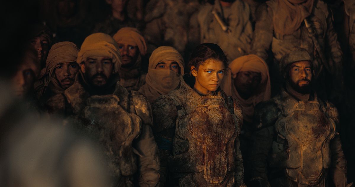 In a crowd of Fremen warriors, Chani’s blue eyes pop as she stares with suspicion or even hatred in Dune: Part Two.