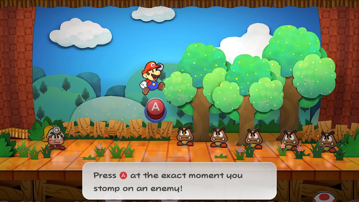 Mario jumps toward a group of Goombas in a stage battle in Paper Mario: The Thousand-Year Door