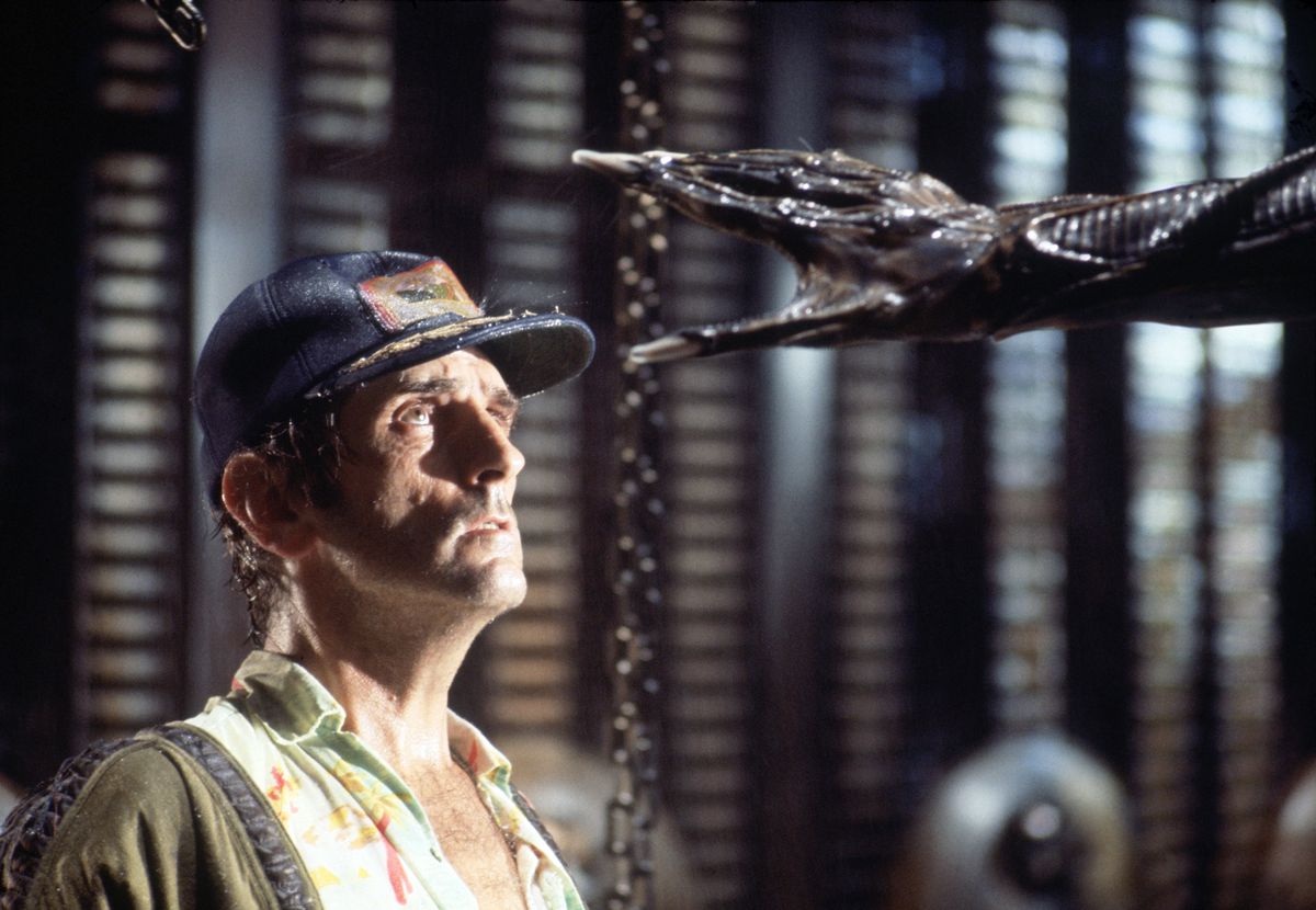 Actor Harry Dean Stanton on the Set of 1979’s Alien, looking up with dread as the Xenomorph’s hand reaches for his head