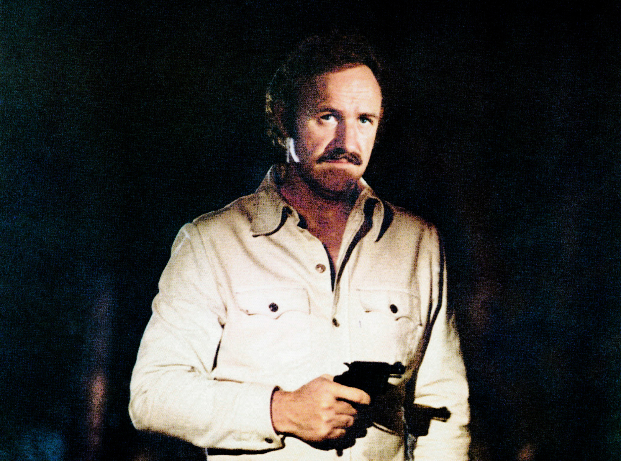 In Night Moves, a sad-looking Gene Hackman holds a revolver in the dark