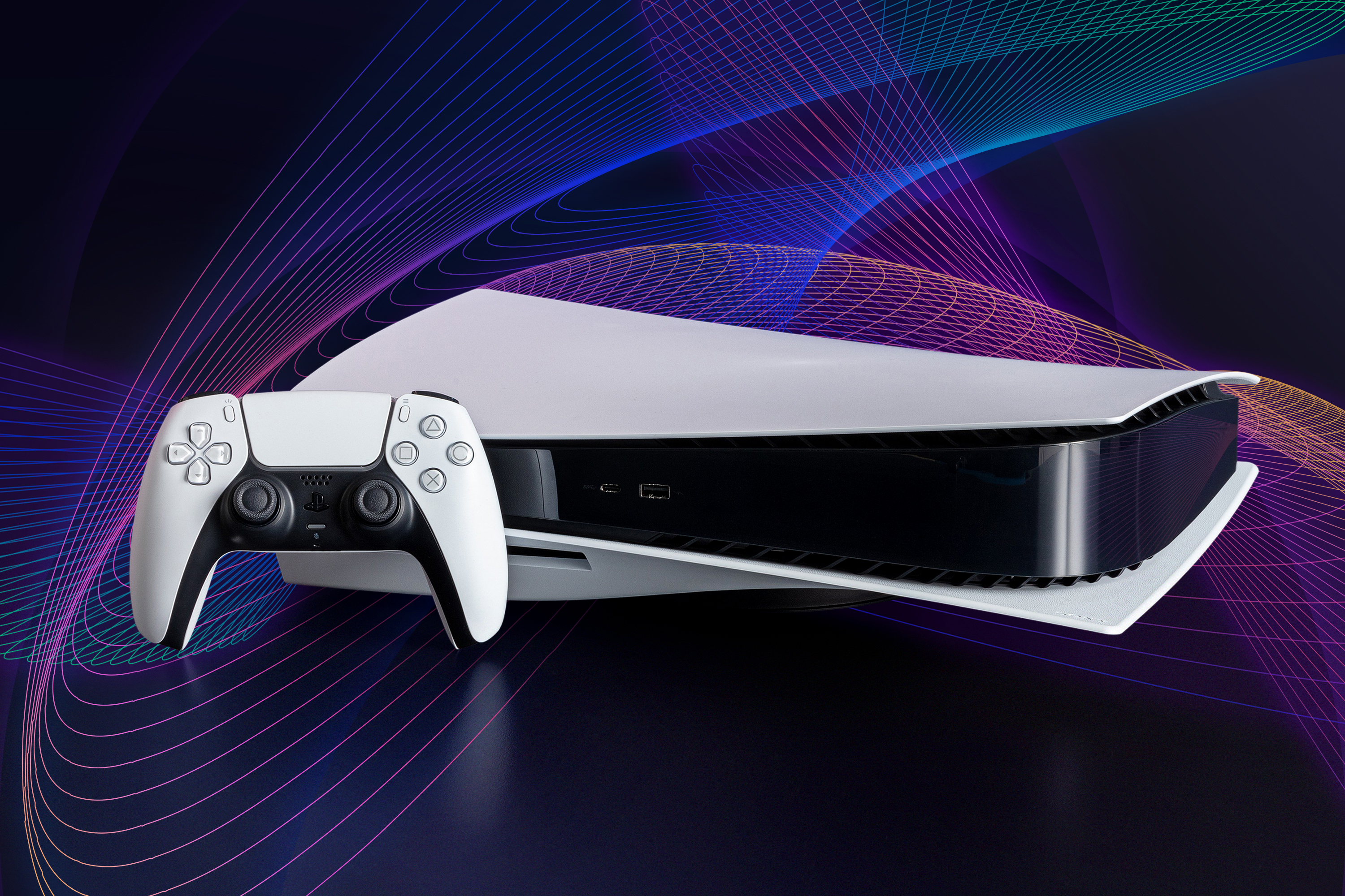 Sony PS5 game console and controller on a dark background with swirling multicolored lines