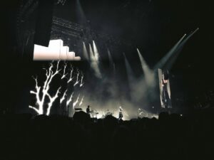 Illuminated concert stage with dramatic lighting effects and empty venue