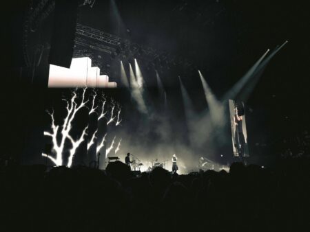 Illuminated concert stage with dramatic lighting effects and empty venue