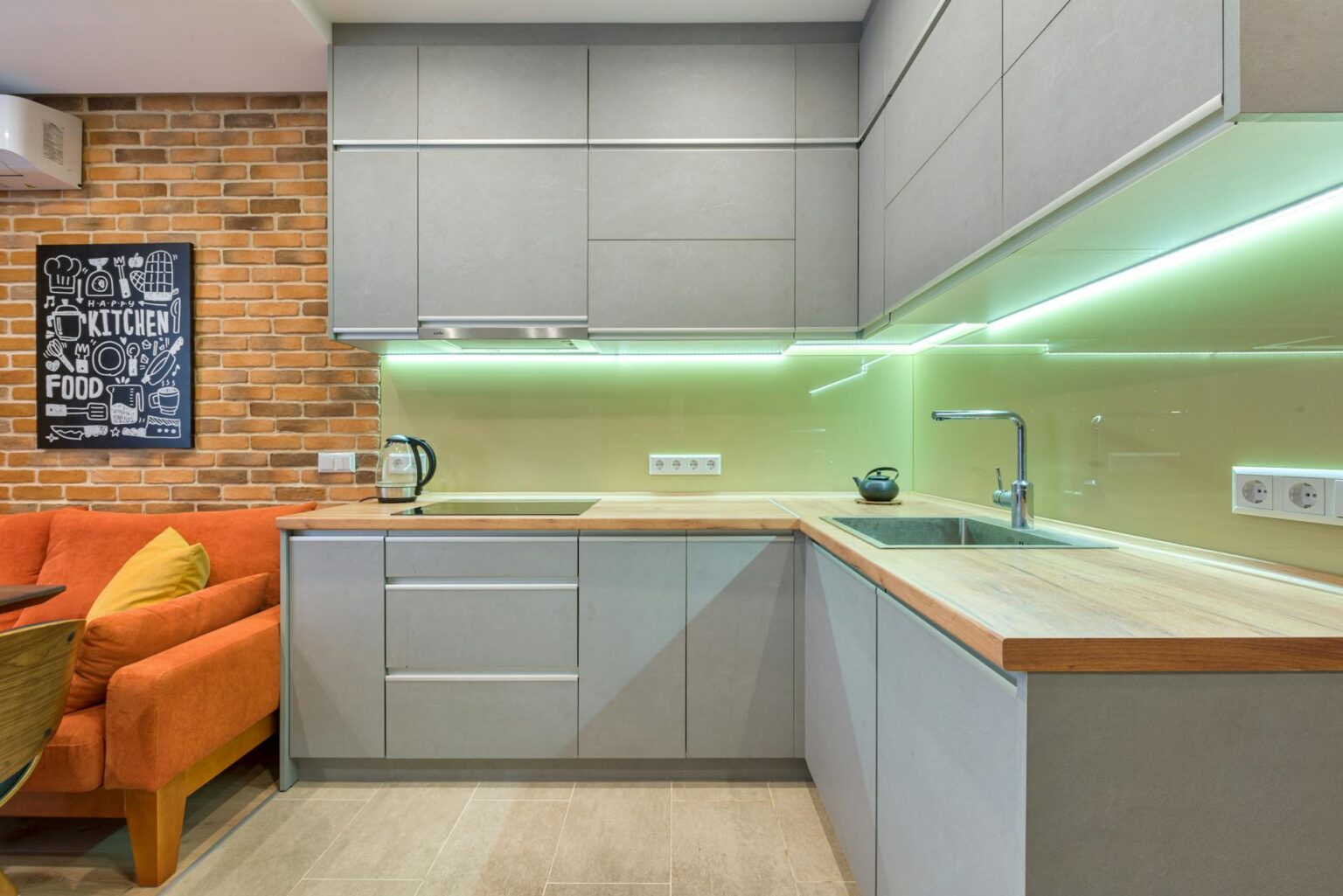 Modern kitchen with sleek appliances and clean countertops showing smart home integration