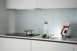 Why Zelda Cookbook Sales Are Outpacing Traditional Gaming Guides Open cookbook on kitchen counter with cooking ingredients and utensils around it