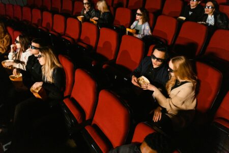 Mario Movie Success Sparks Nintendo’s Expanded Hollywood Partnership Plans Cinema interior showing movie screens and seating representing Nintendo's film expansion