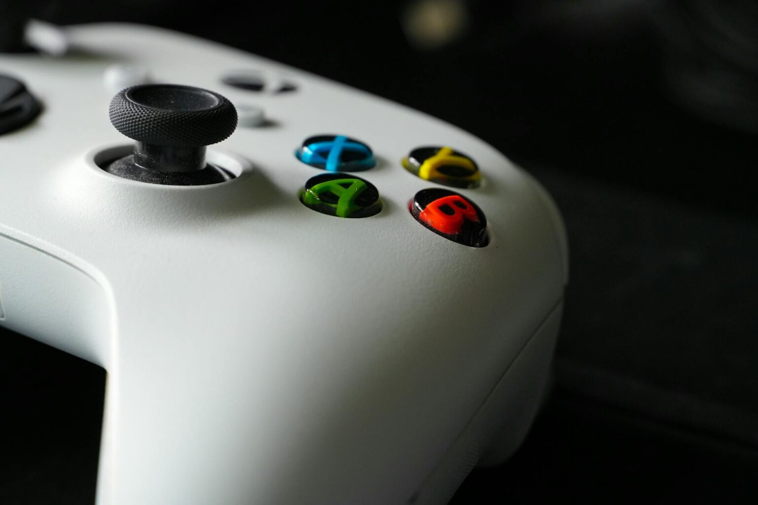Modern gaming controller on dark surface representing Xbox gaming technology