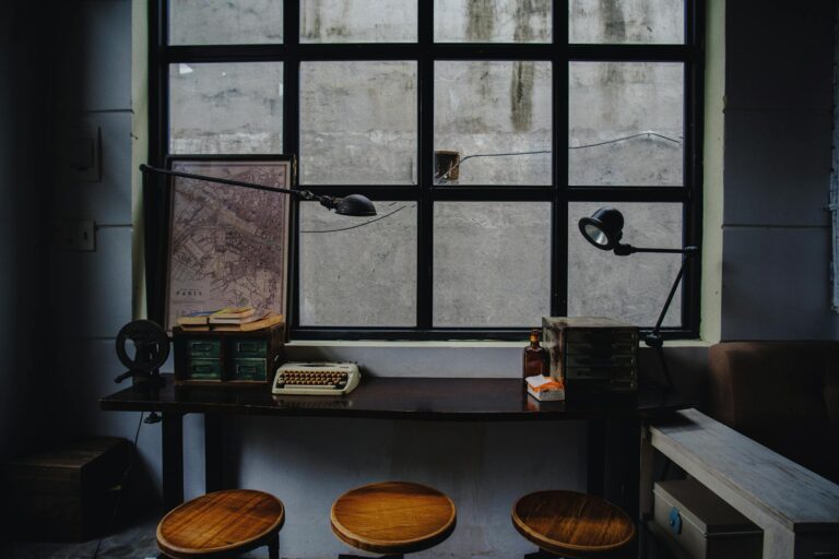 Compact gaming setup on a college dorm room desk with minimal space