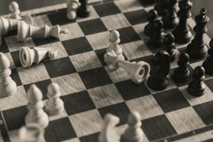Chess pieces on board showing strategic positioning and tactical gameplay elements