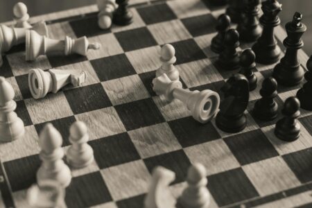 Chess pieces on board showing strategic positioning and tactical gameplay elements