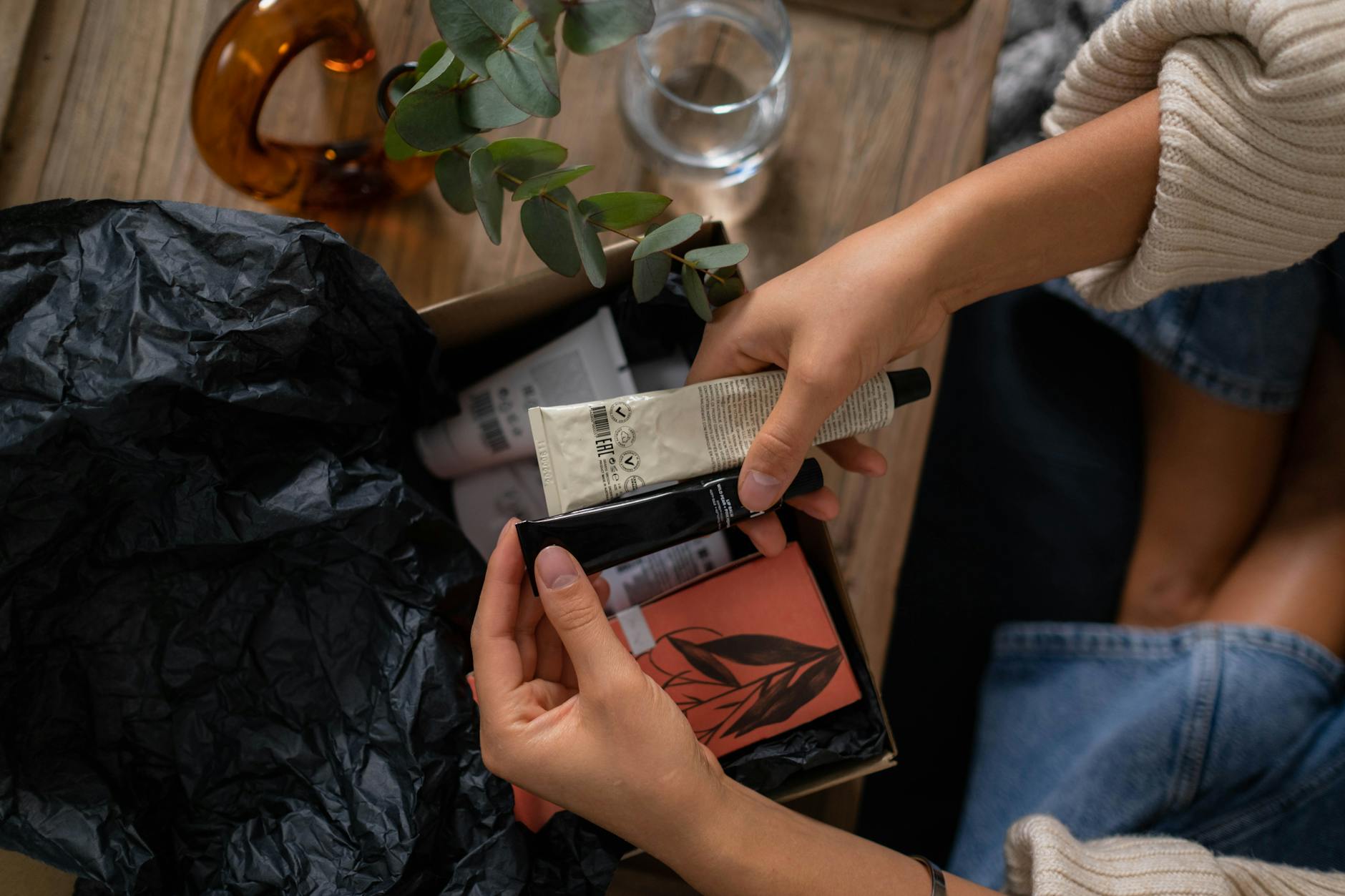 Open subscription box containing various collectible items and merchandise