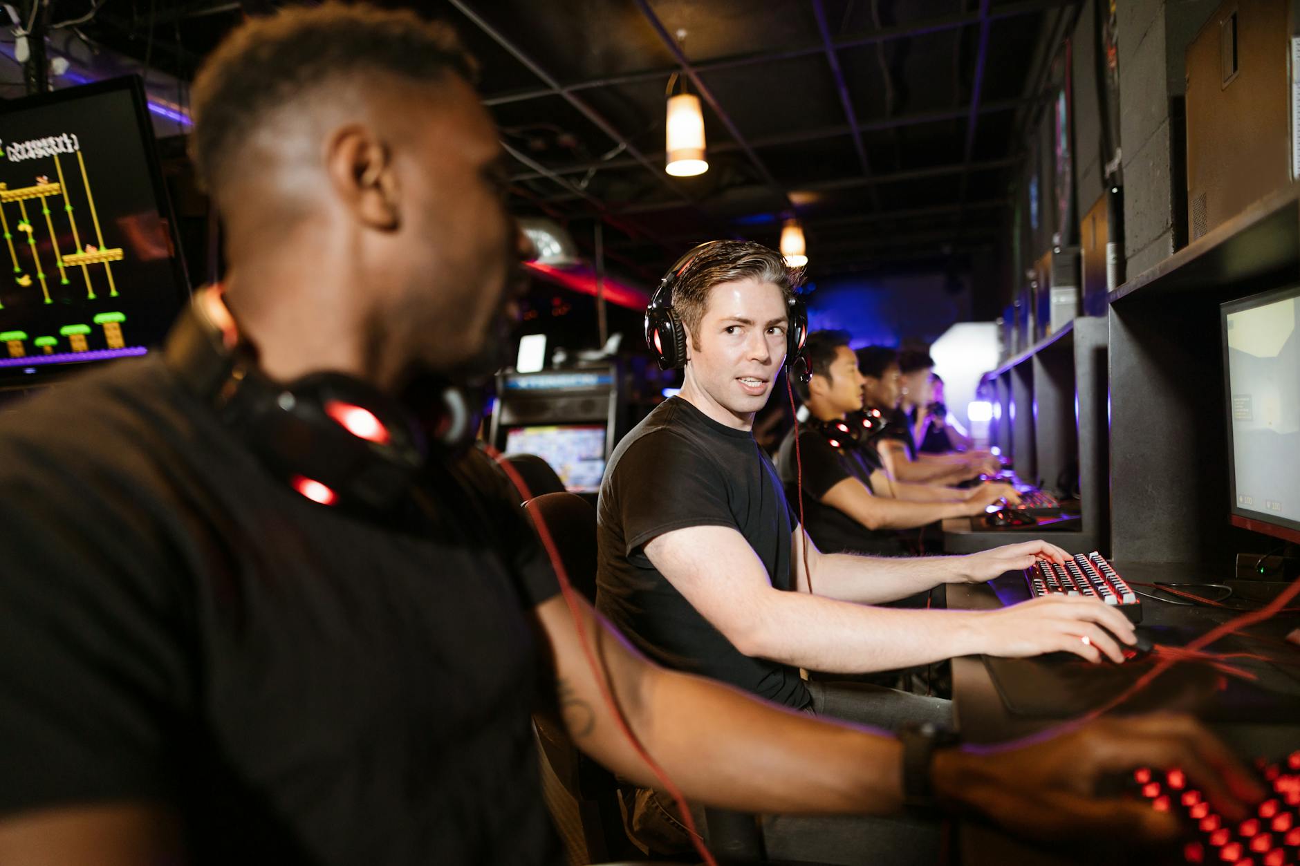 Group of friends playing video games together in a social gaming environment