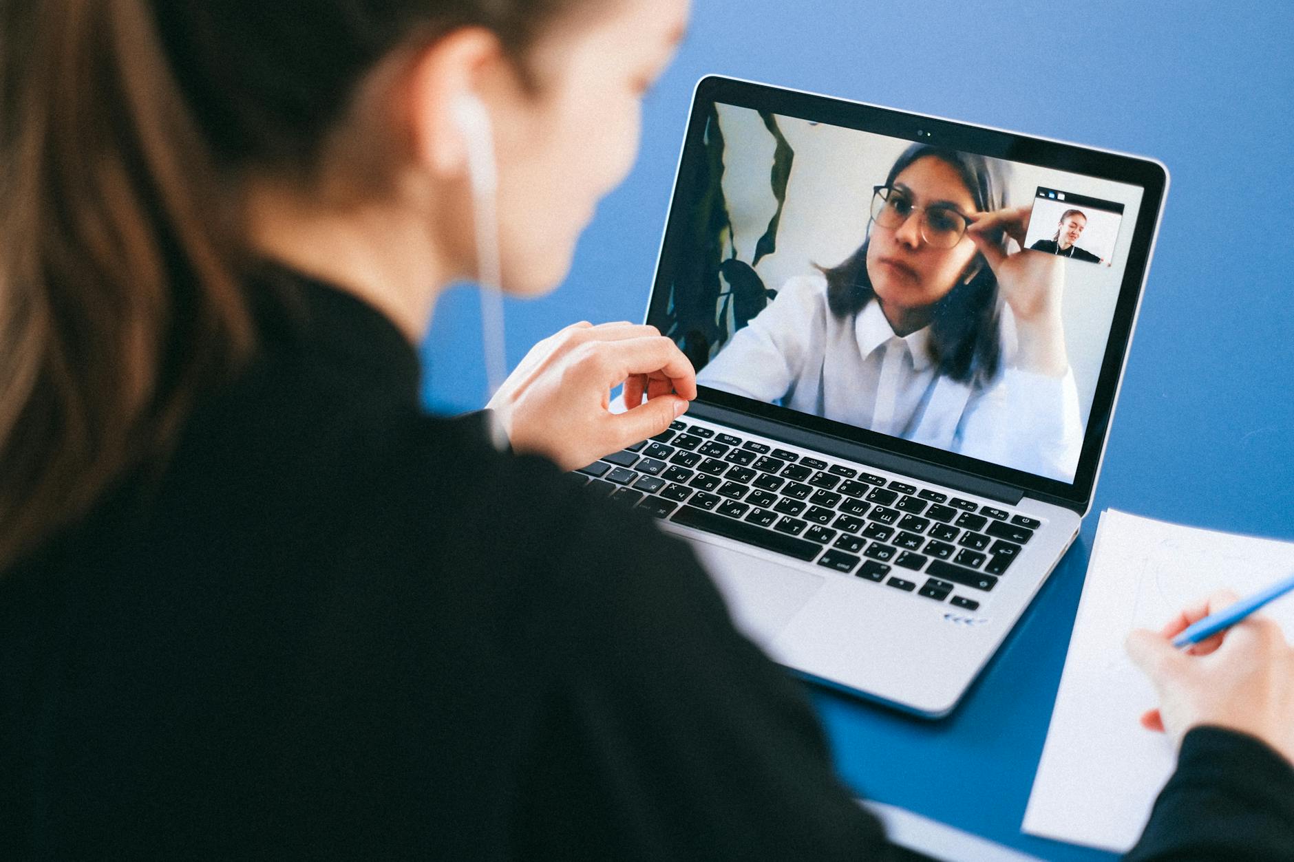Person participating in video conference call from home office