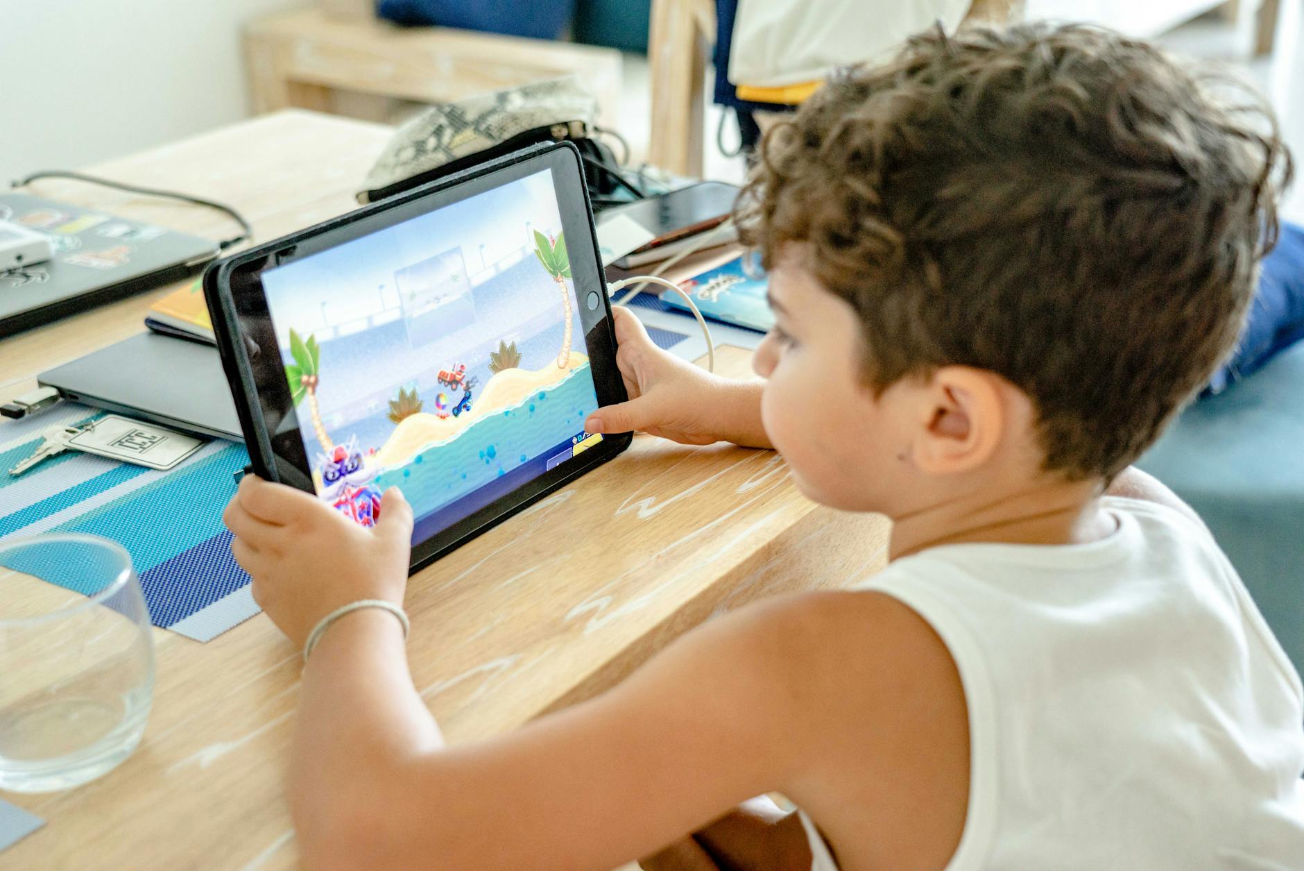 Family members using tablet device for gaming showing multi-user access