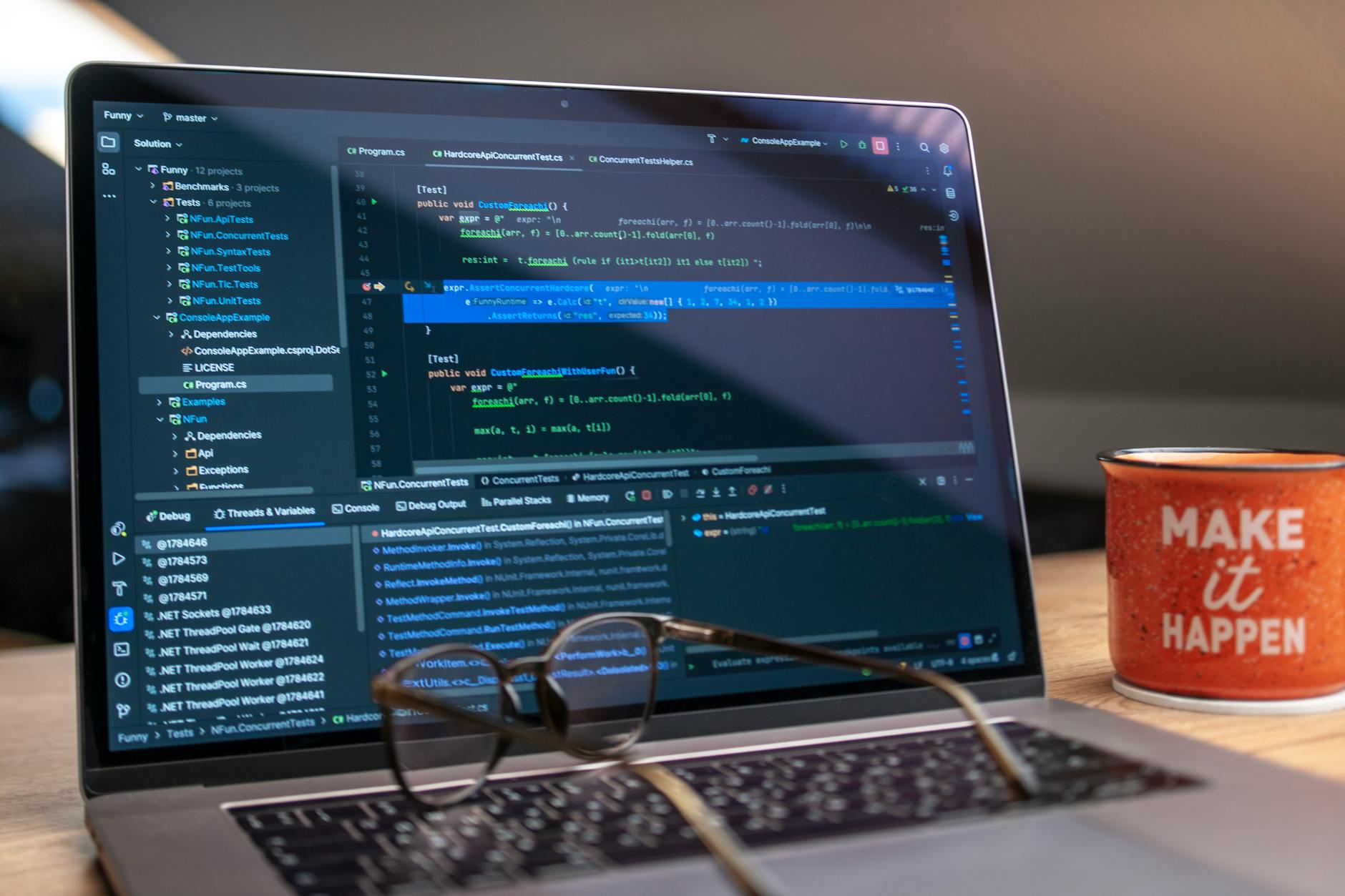 Developer working on code optimization and game development on multiple monitors