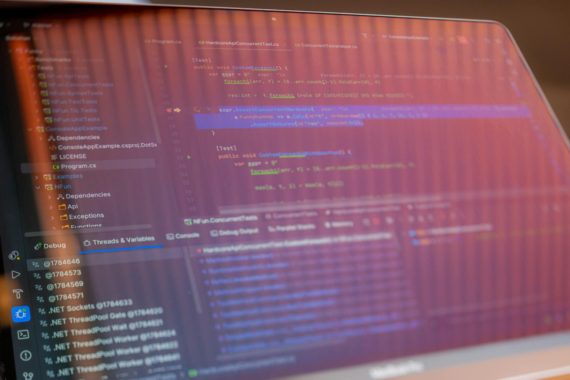 Software developer working on code at computer workstation