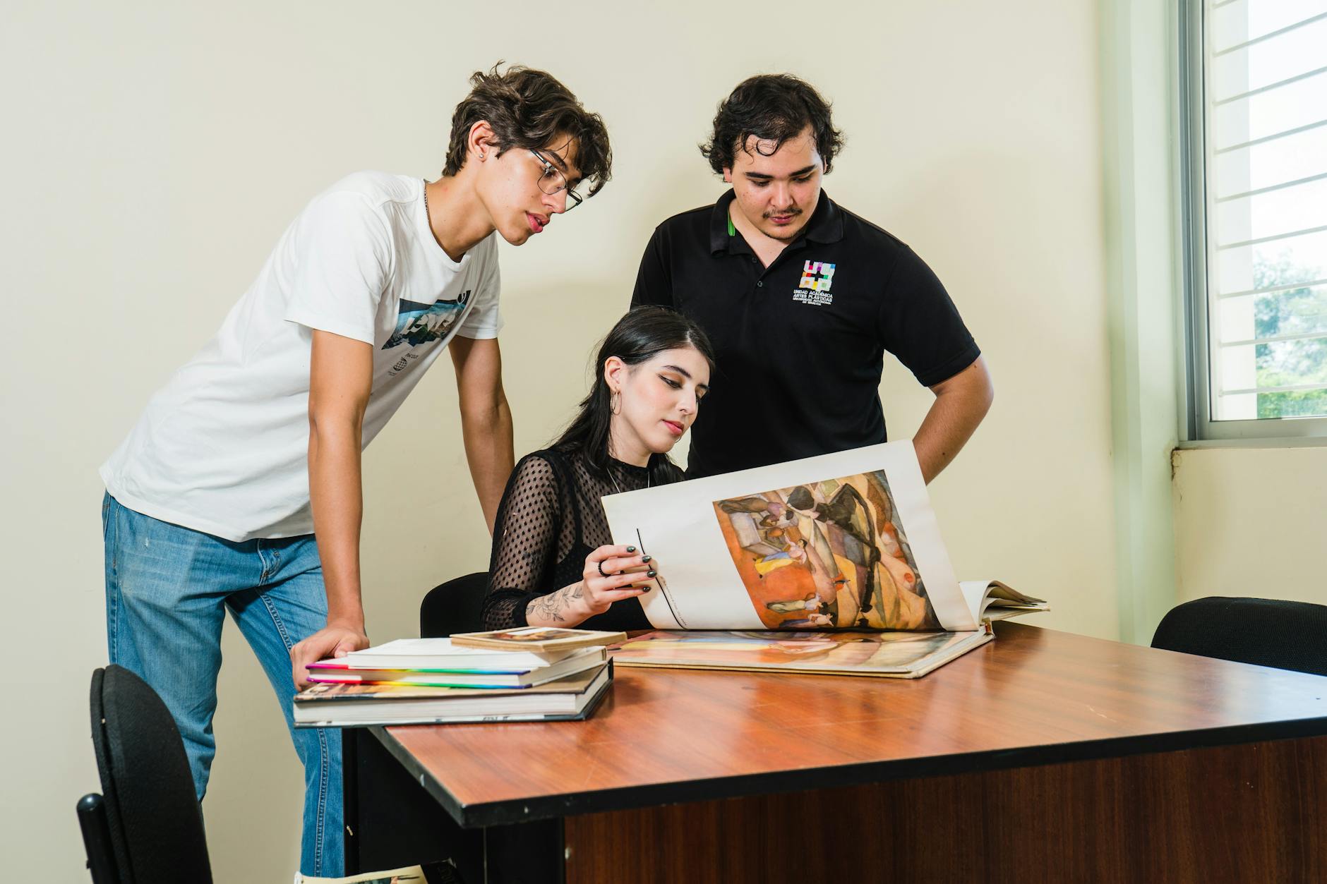 College students playing video games together in a dorm room setting