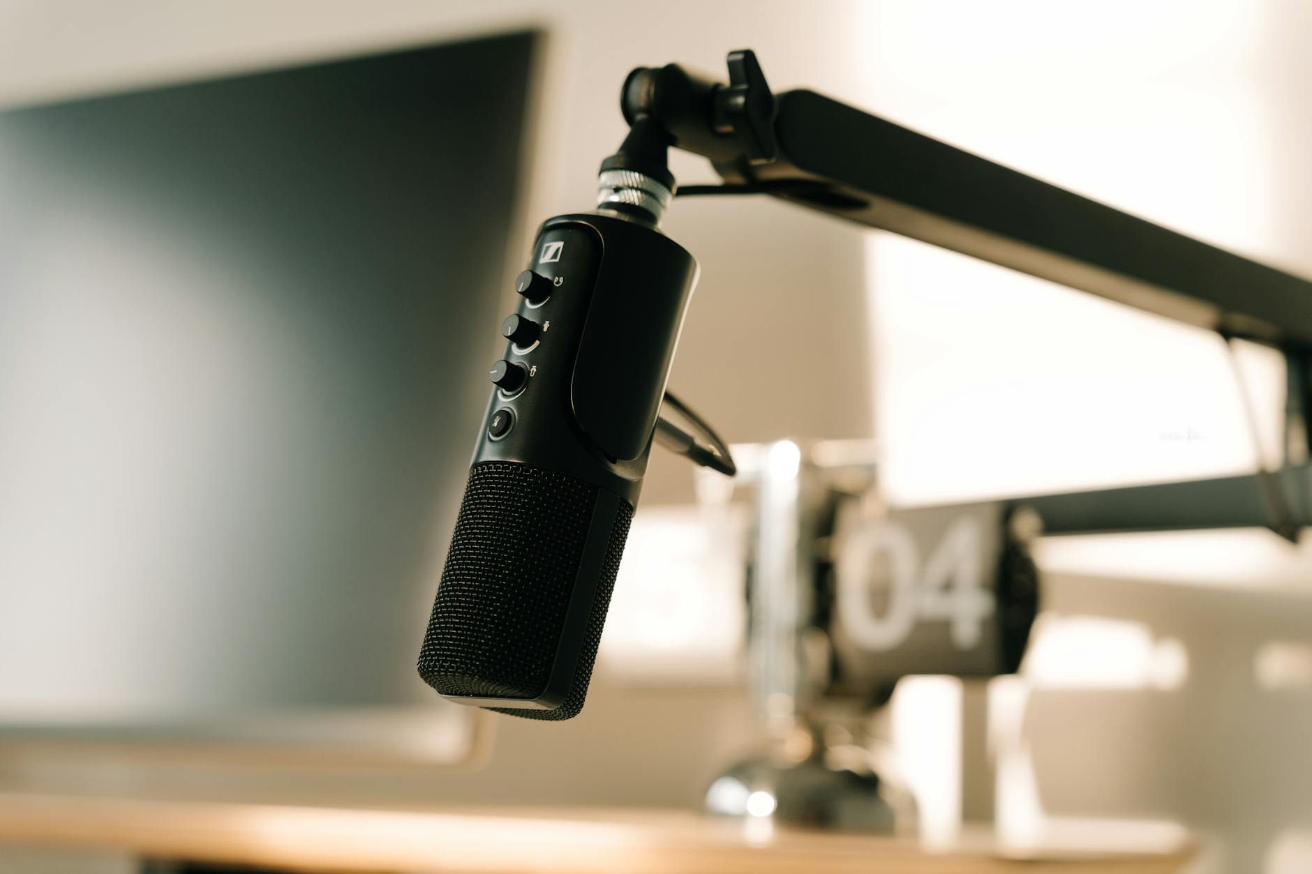 Professional streaming equipment including microphones, cameras, and lighting gear on a desk surface