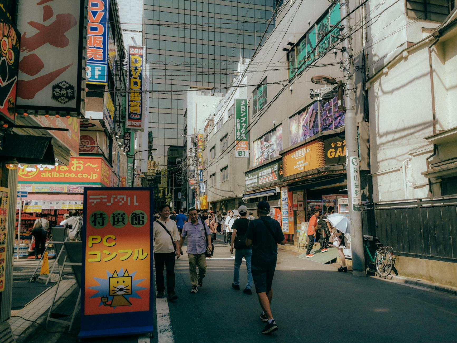 Electronic retail store interior with gaming displays and bright lighting