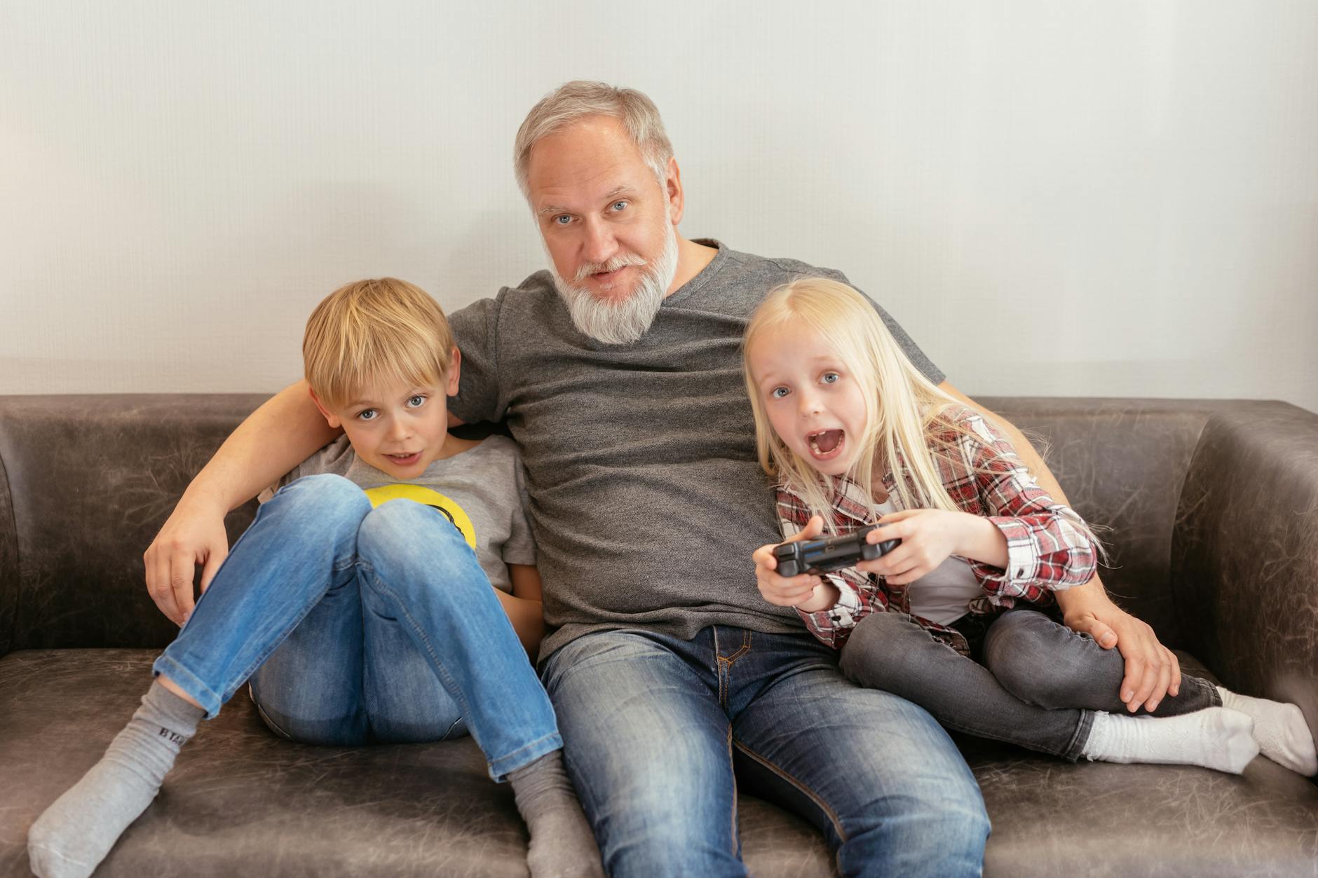Family members enjoying video games together in living room setting