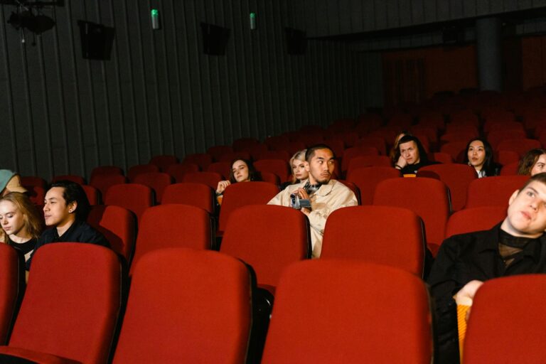 Audience gathered in a cinema for a major film premiere event