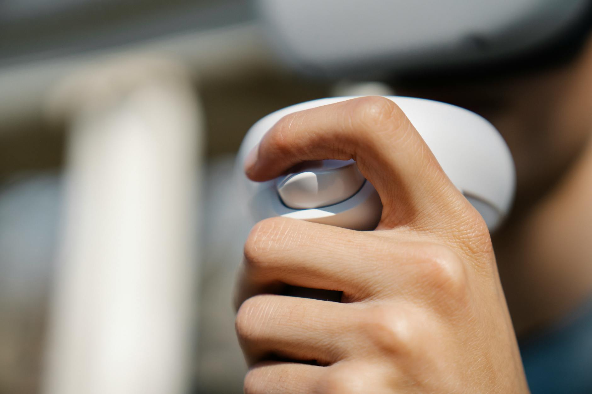 Close-up of a video game controller analog stick showing wear detail