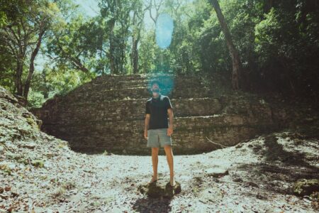 A dense jungle environment with ancient ruins suggesting open-world exploration