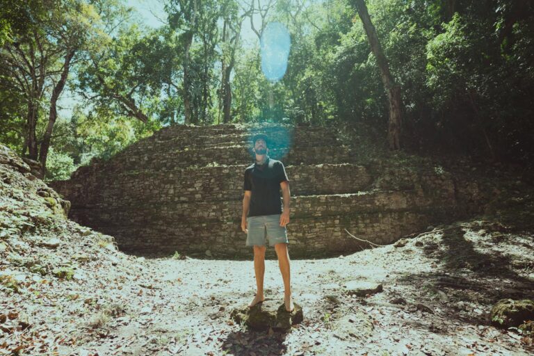 A dense jungle environment with ancient ruins suggesting open-world exploration