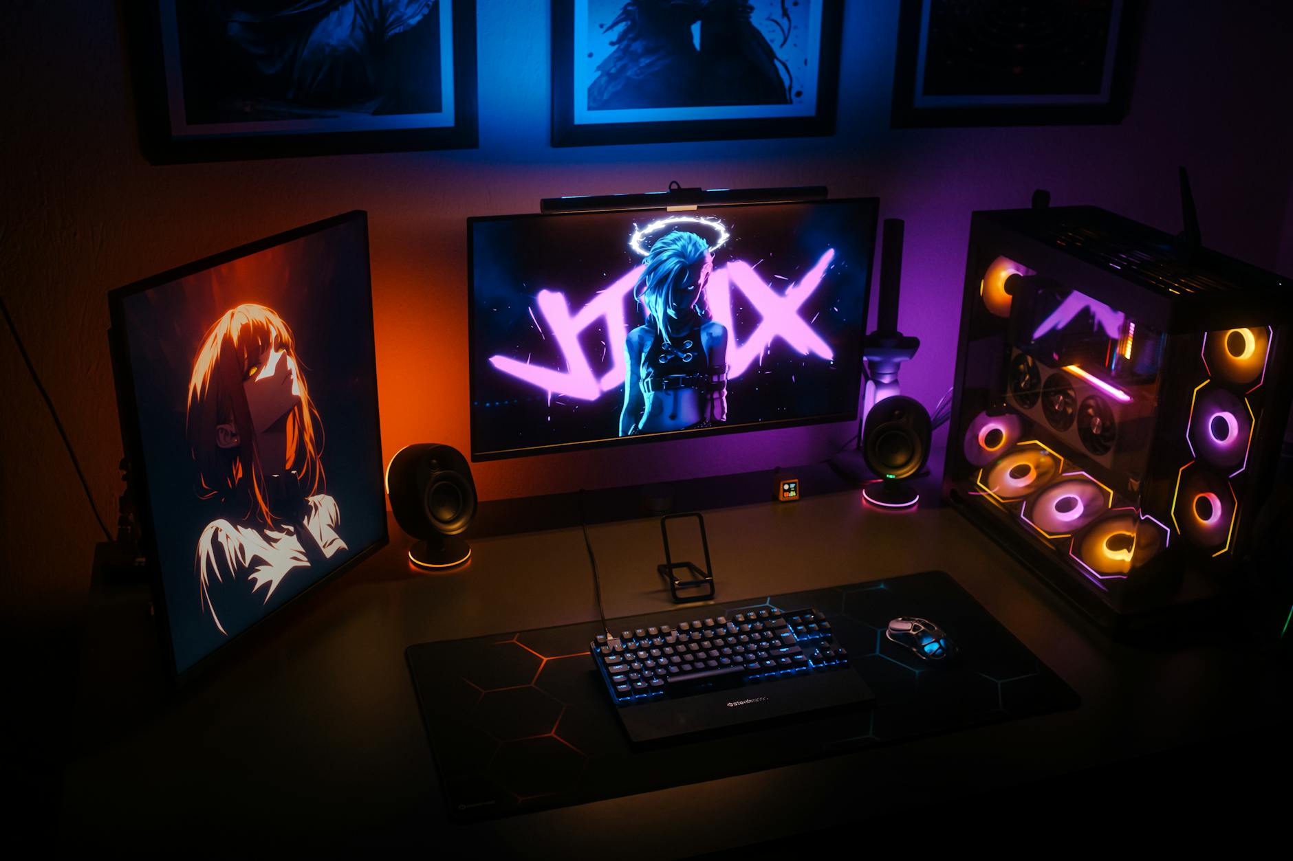 Modern gaming setup with multiple monitors displaying streaming content