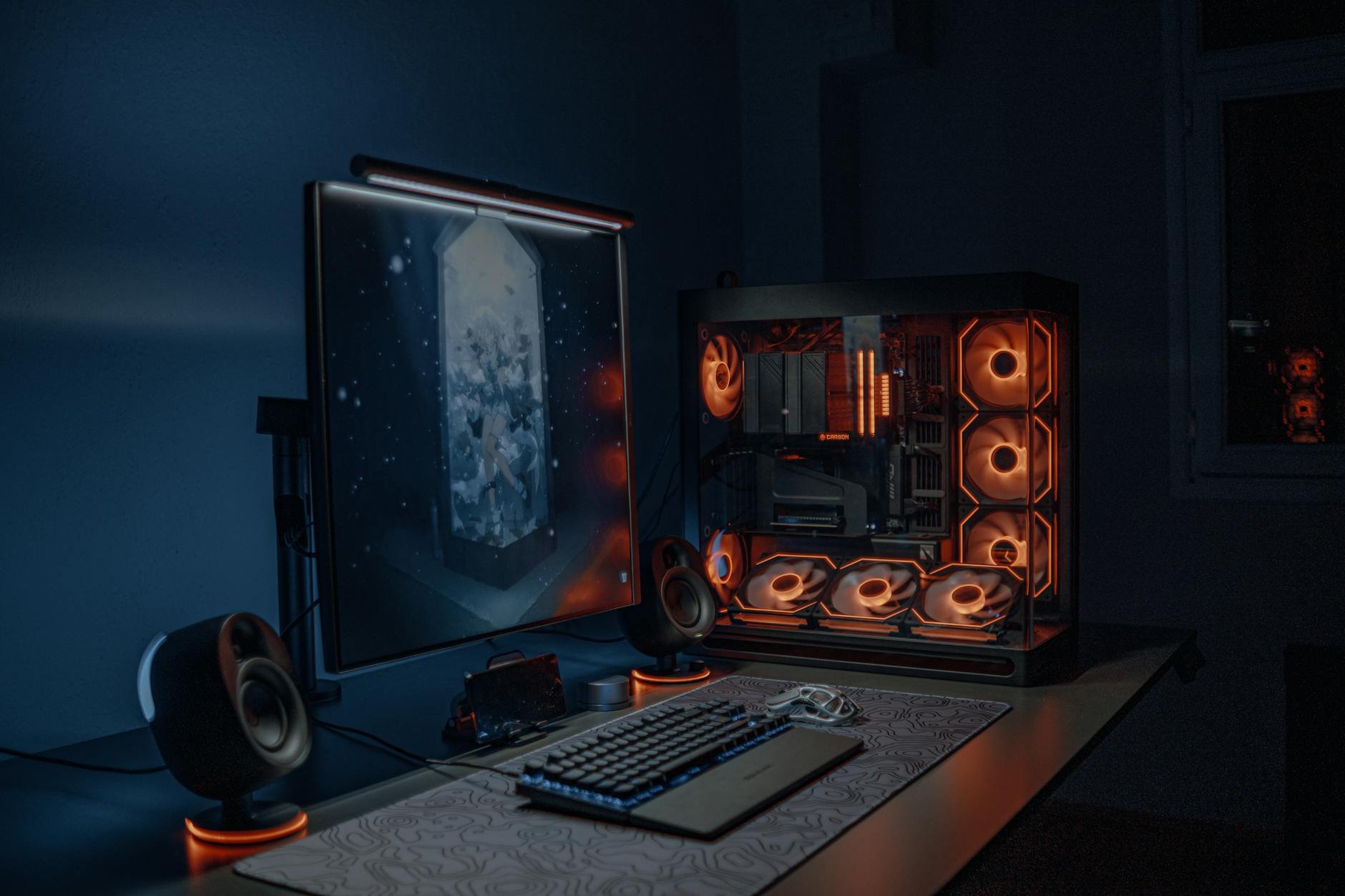 Modern gaming computer setup with multiple monitors displaying game interfaces