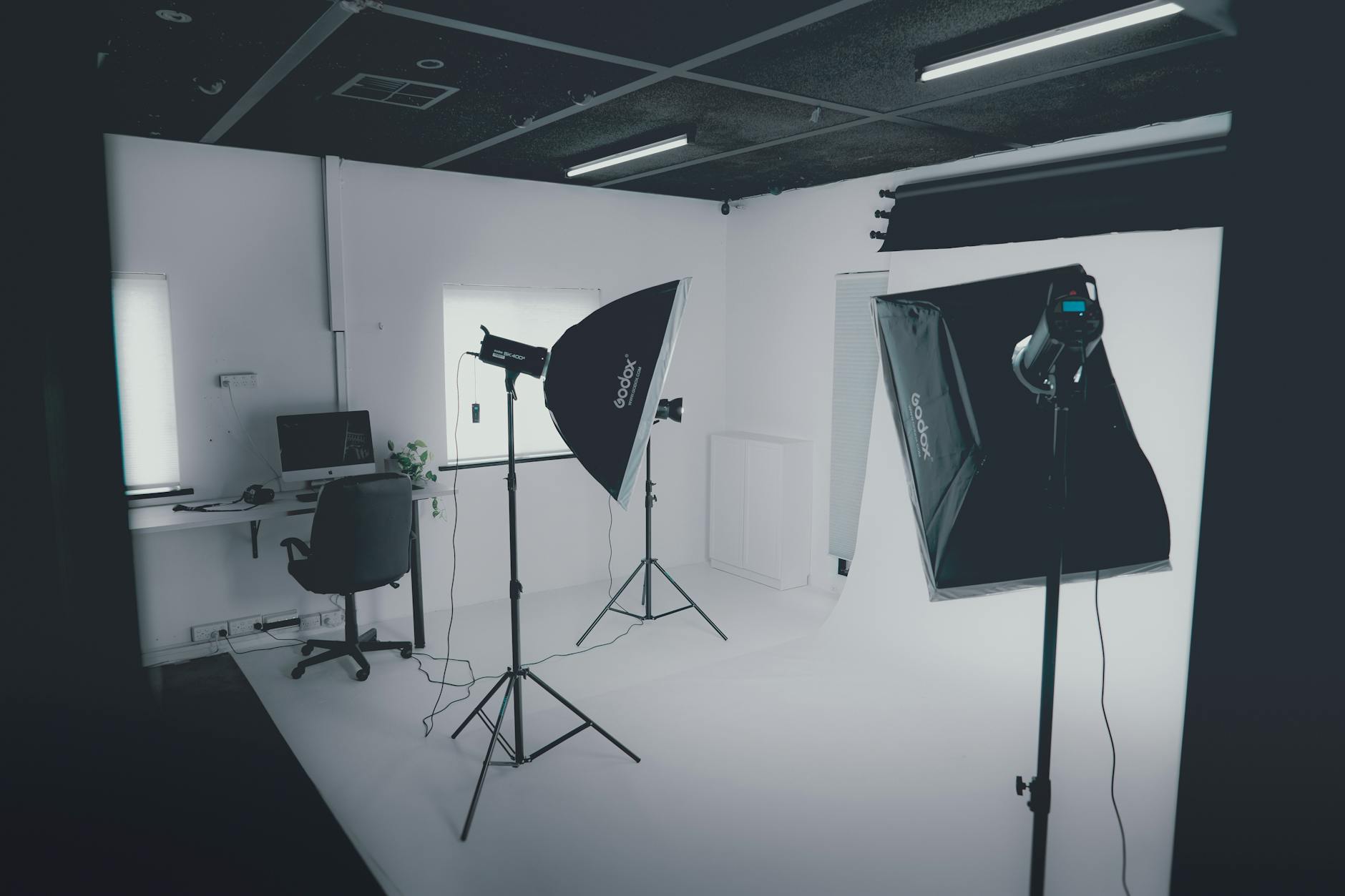 Animators working at computer workstations in modern studio environment  