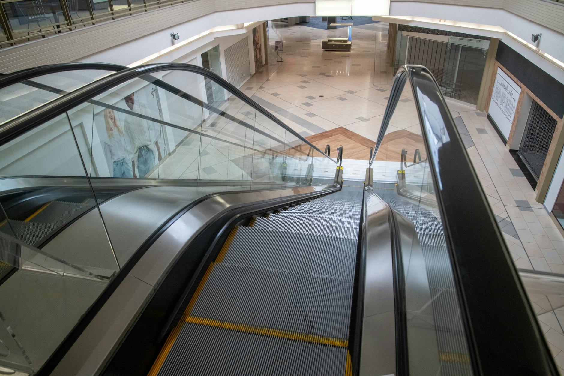 Empty retail store shelves with sparse product inventory