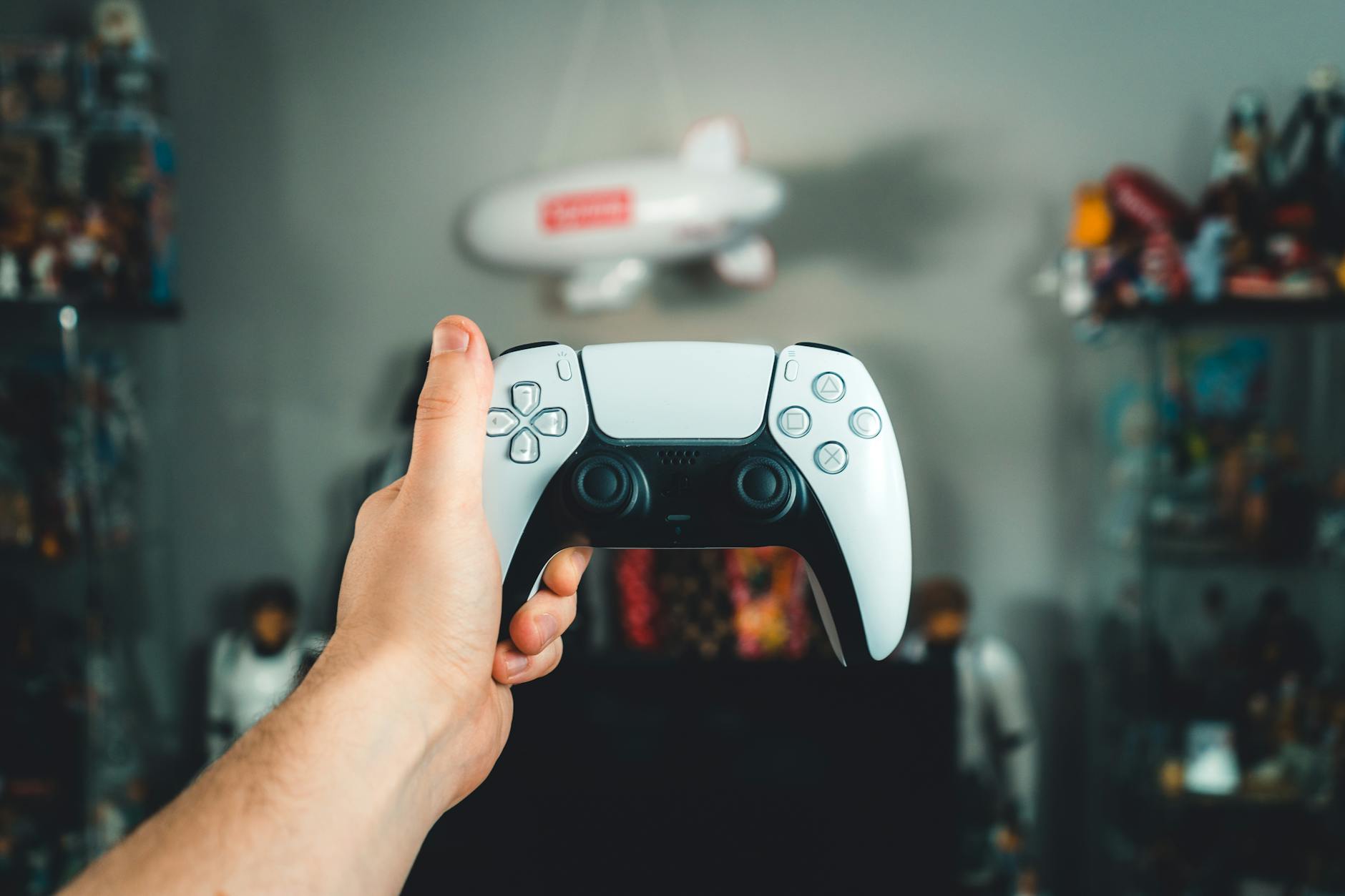 A gaming console and controller on a desk ready to play