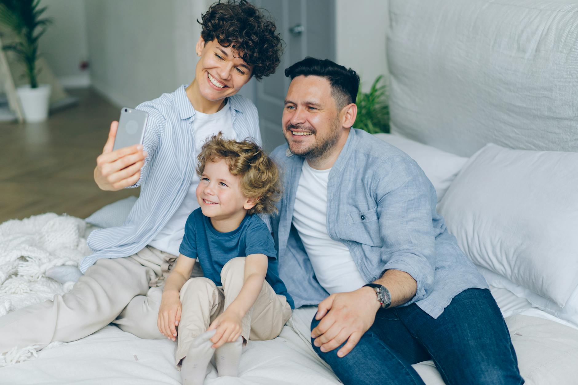 Family members using various devices and technology together at home