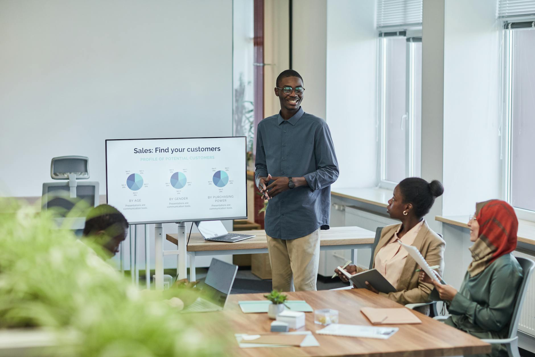 Corporate executives reviewing financial charts and strategy presentations in modern conference room