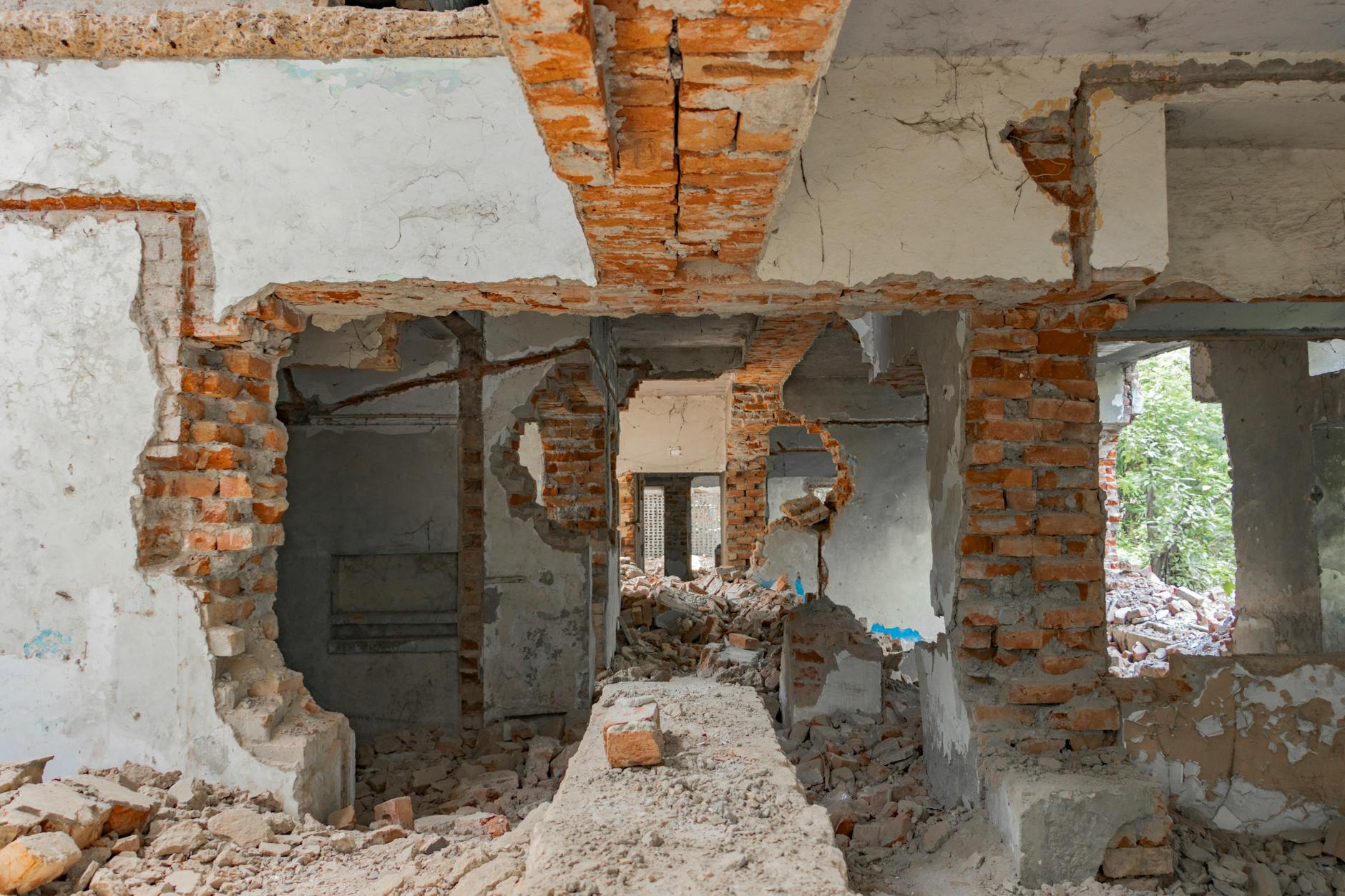 A crumbling stone wall with chunks of debris, evoking terrain destruction mechanics