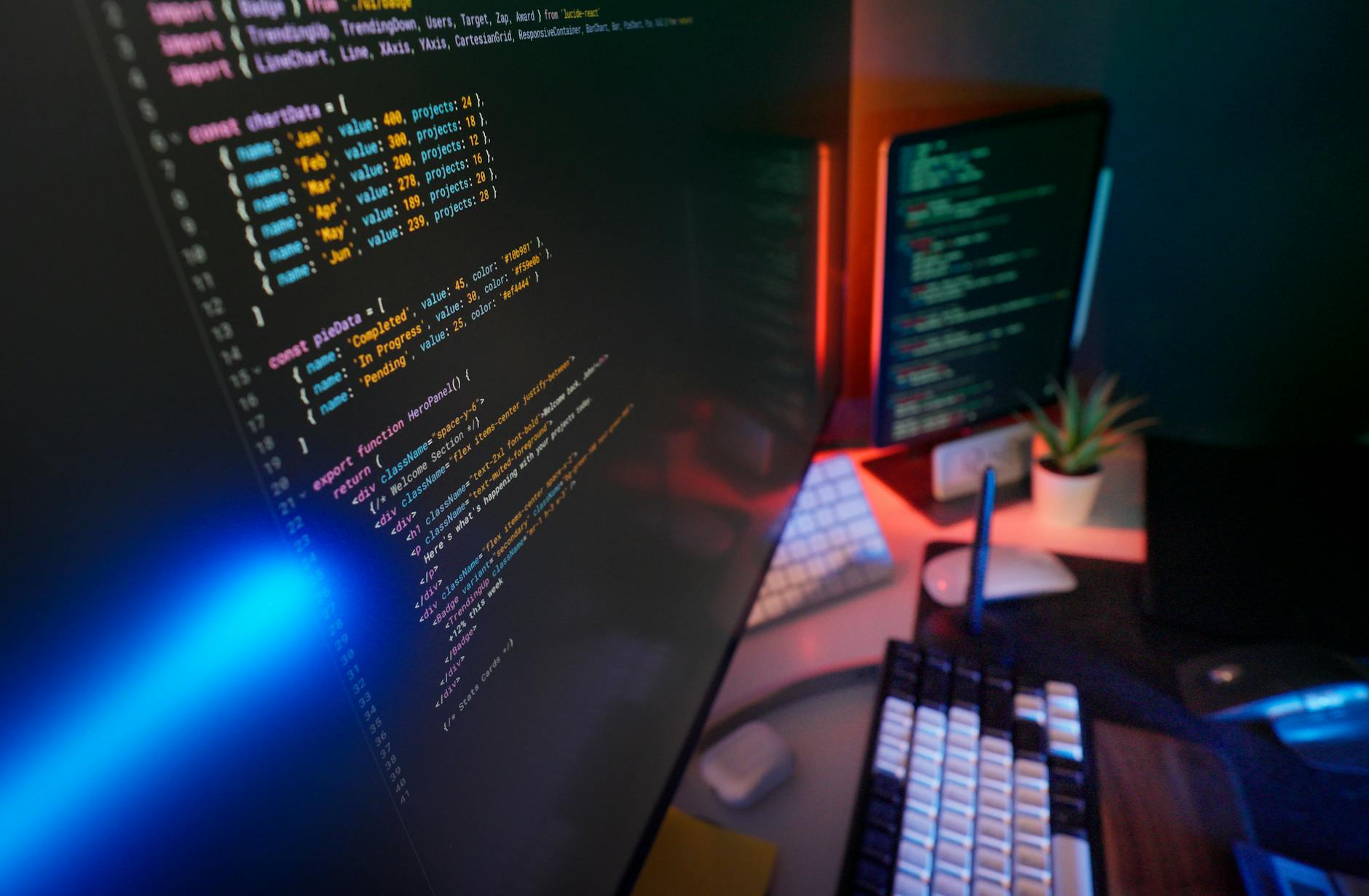 Close-up of code on a monitor in a dark studio environment