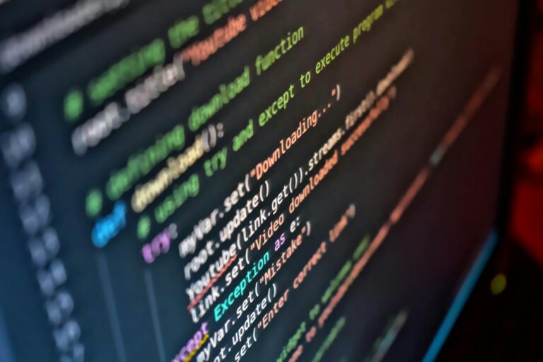 Close-up of a developer's screen showing game engine code and physics simulations
