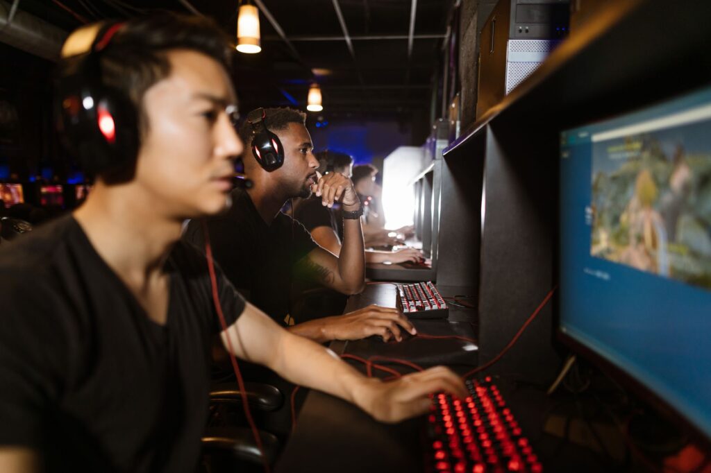 Steam’s Wishlist Algorithm Overhaul Is Burying Midsize Studios A gaming PC setup with a monitor displaying a game library interface