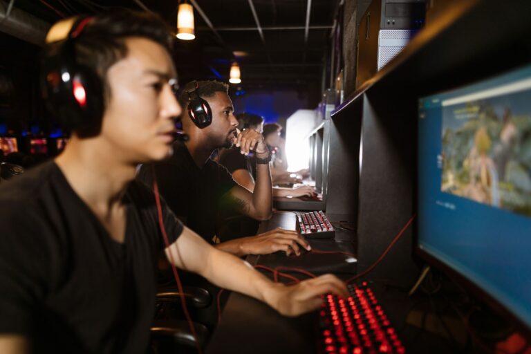 Steam’s Wishlist Algorithm Overhaul Is Burying Midsize Studios A gaming PC setup with a monitor displaying a game library interface