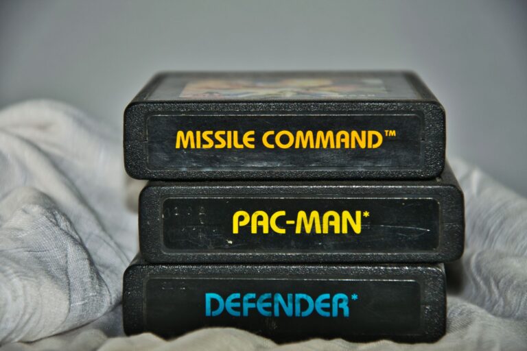 A physical video game cartridge held between two fingers, representing physical game ownership concerns