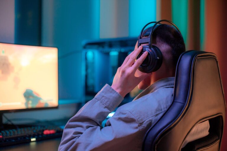 Developers working at computers in a modern video game studio