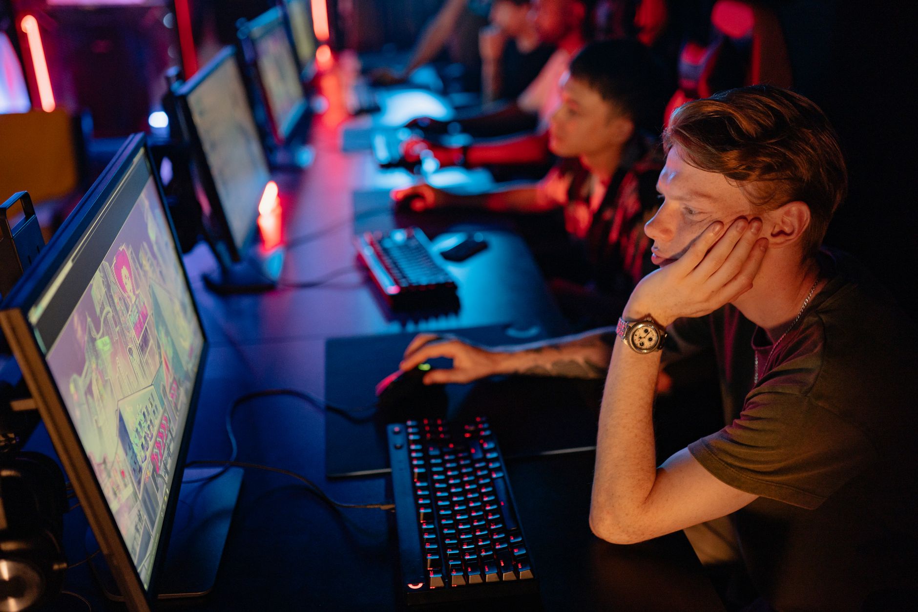 Competitive gaming audience watching an esports tournament on large screens