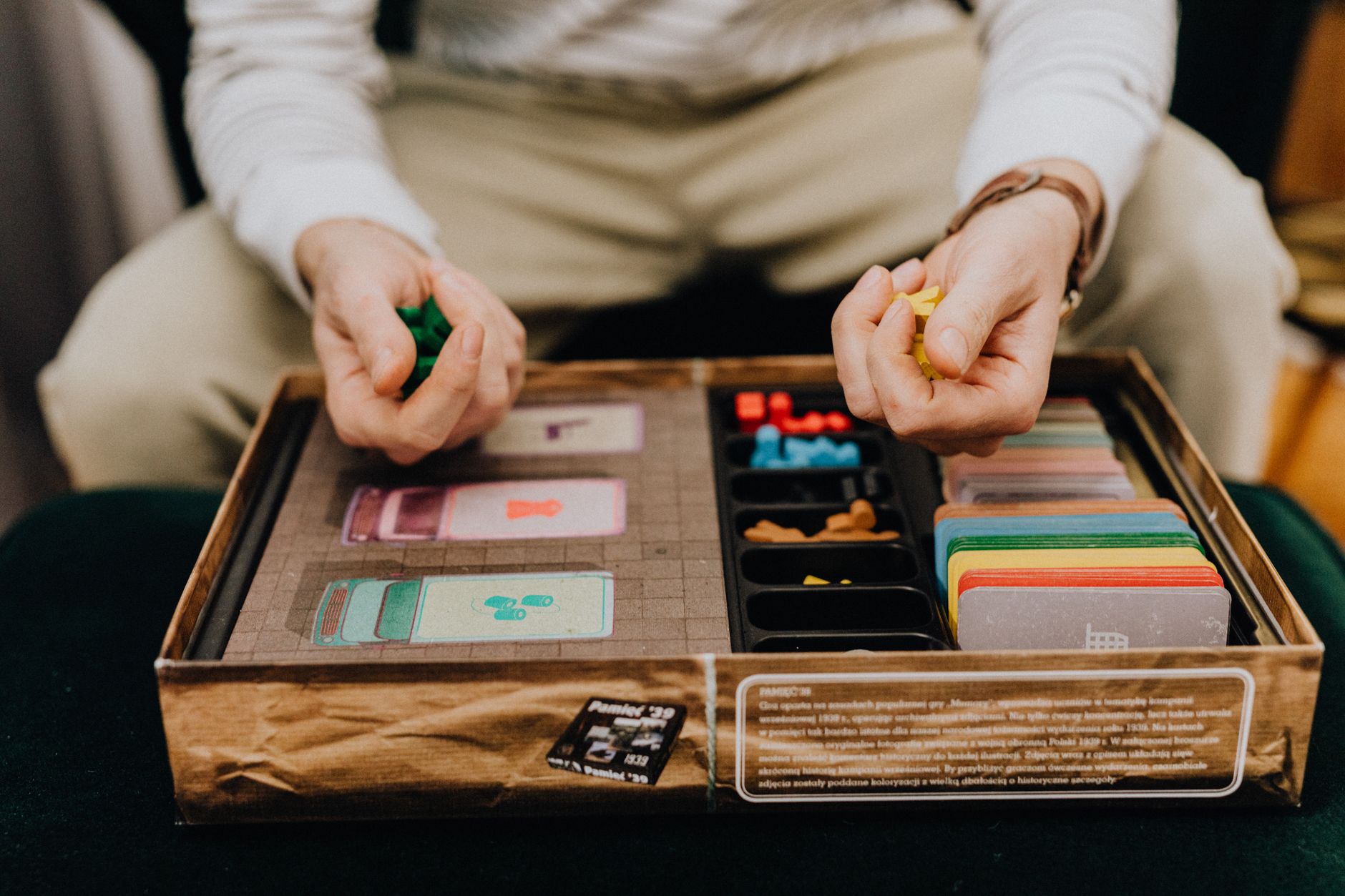 Friends gathered around a board game during a casual game night